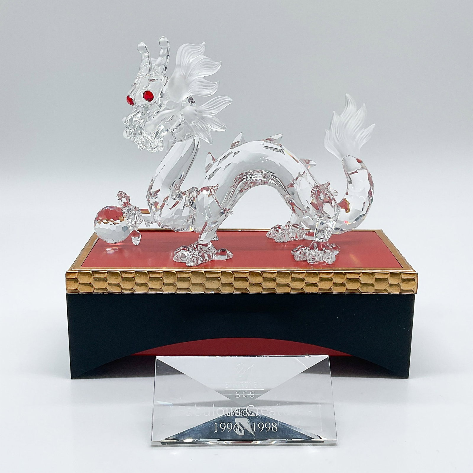 3pc Swarovski Crystal Figurine, Dragon + Plaque, Base 208398: This Swarovski crystal figurine, the 1997 Annual Edition Dragon, is part of the ?Fabulous Creatures? trilogy. Designed by Gabriele Stamey, it is crafted mainly from clear crystal with frosted crystal 