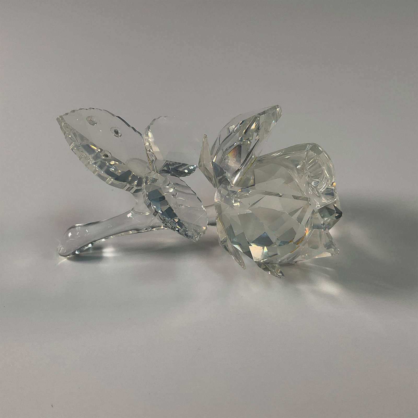 Swarovski Crystal Figurine, Rose: Part of the Exquisite Accents collection, then later moved to the In the Secret Garden. This Swarovski crystal figurine showcases a beautifully crafted rose, complete with faceted petals and leaves th