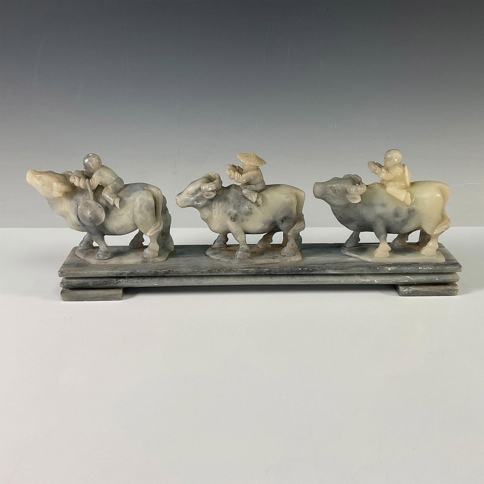 Chinese Gray Soapstone Carving of Figures Riding Oxen (1 of 3)