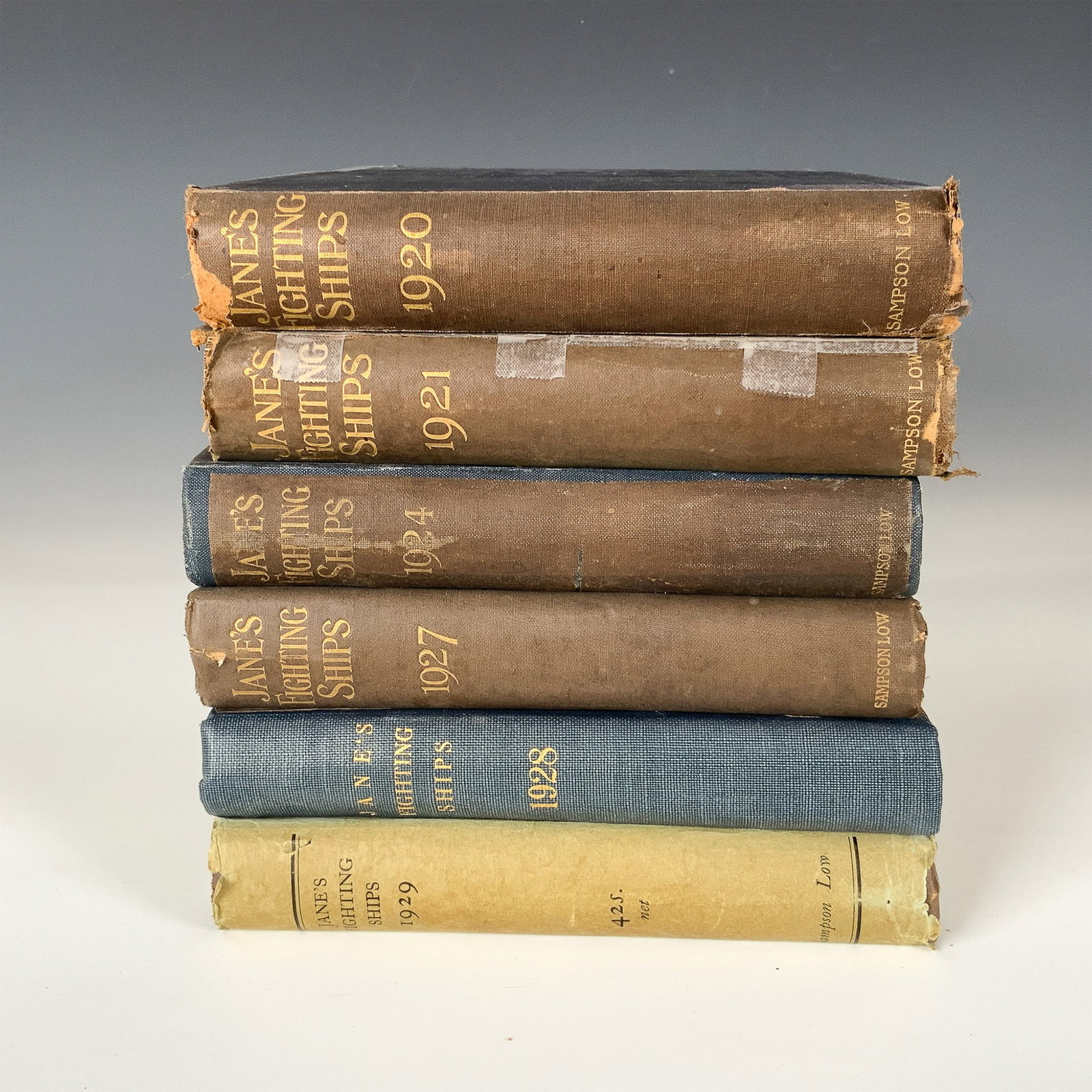 Set of 6 Jane Fighting Ships Reference Books, 1920-1929: This lot features a set of six early editions of Jane's Fighting Ships, the authoritative reference series detailing naval fleets worldwide. Included are the 1920, 1921, 1924, 1927, 1928, and 1929 edi
