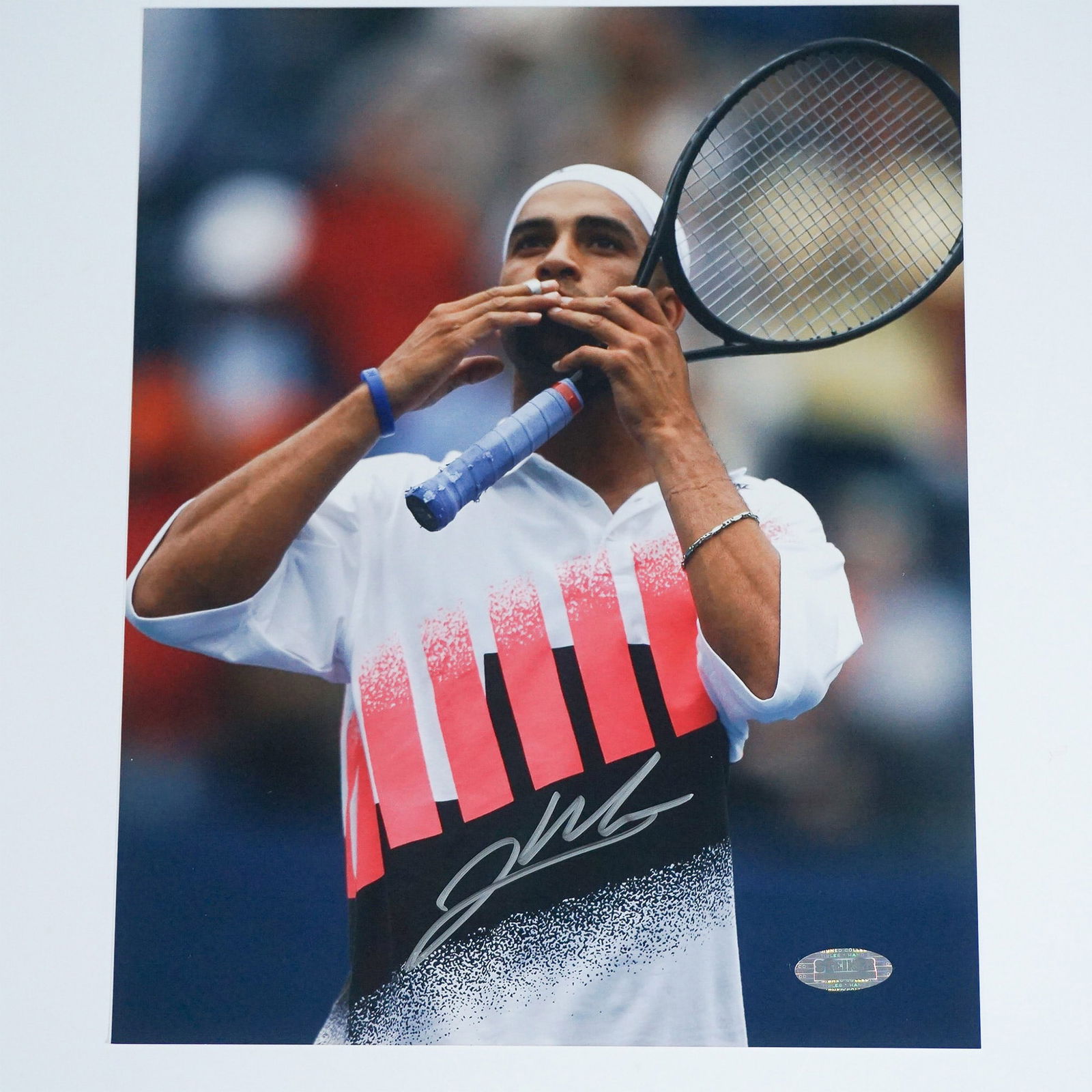 James Blake Signed Andre Agassi Tribute Photograph with COA: Official James Blake autographed 8x10 photograph, capturing the former professional tennis star in a tribute to Andre Agassi. Blake, known for his electrifying speed and powerful forehand, was a fan f