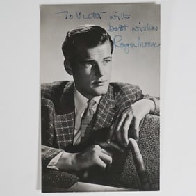 Roger Moore Autographed Black and White Photograph