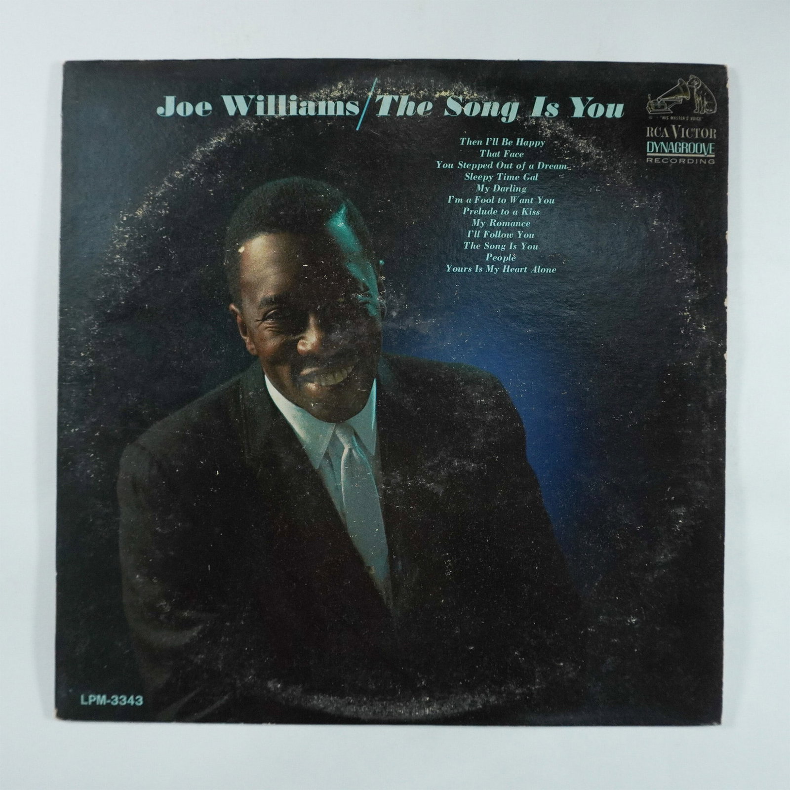 Joe Williams The Song Is You Vinyl Record RCA Victor: RCA Victor Dynagroove mono vinyl record The Song Is You featuring Joe Williams. This album highlights Williams' smooth and expressive baritone voice with jazz and pop standards such as Yours Is My Hea