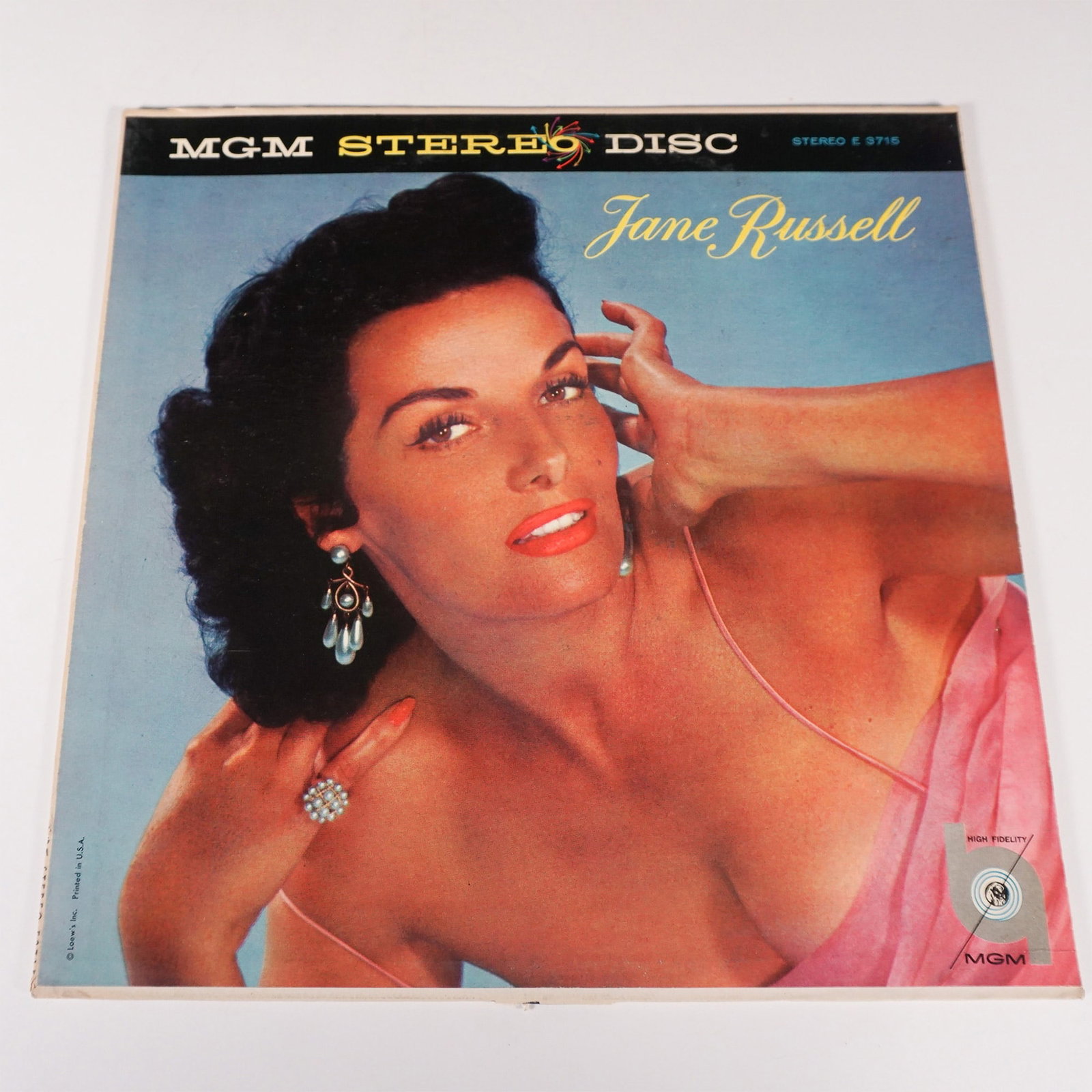 MGM Stereo Disc Jane Russell Vinyl Album E3715: MGM Stereo Disc vinyl album featuring Jane Russell, catalog number E3715. This rare record showcases the sultry vocals of the iconic actress and singer, with arrangements by Joe Rotondi and Billy May.