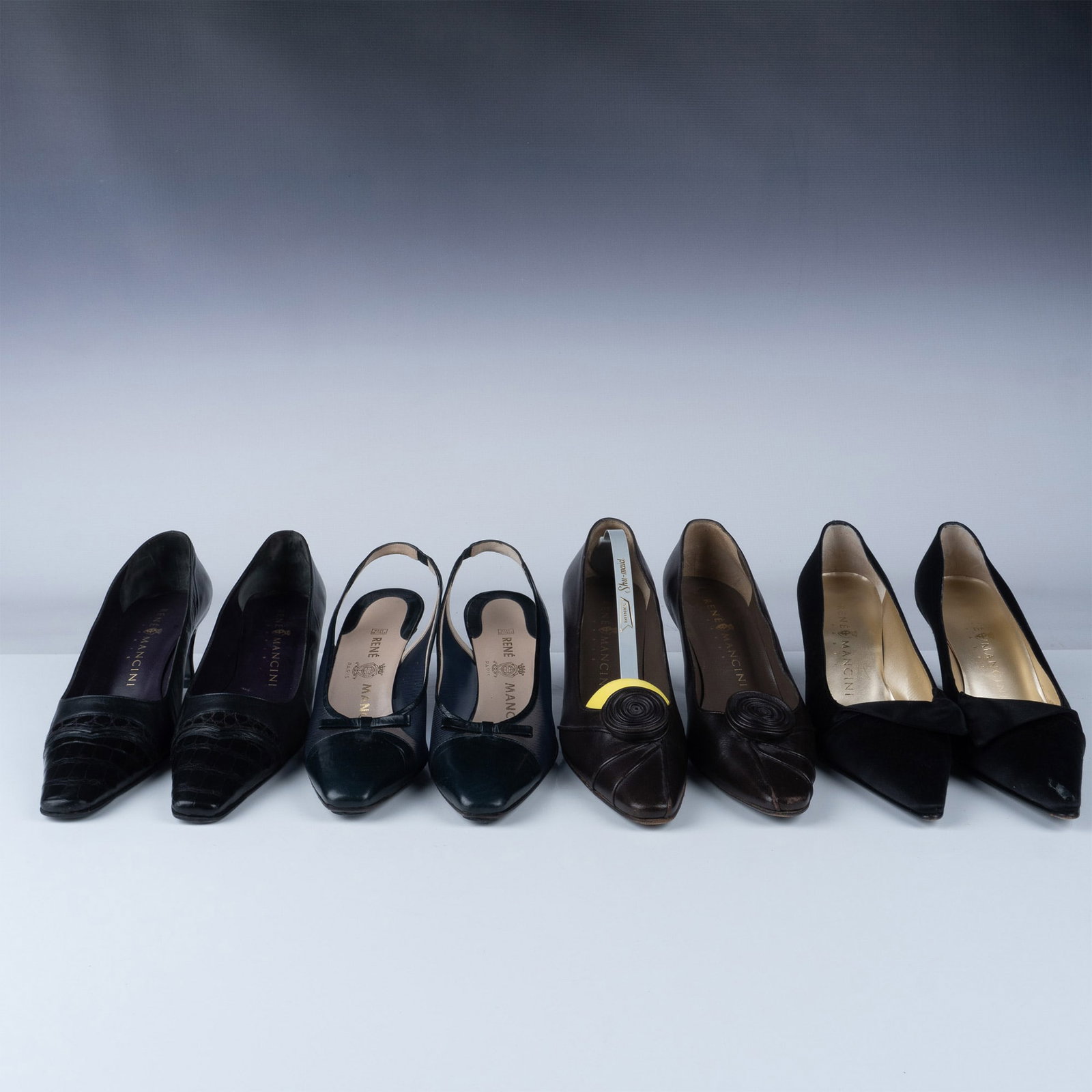 4 Pairs of Rene Mancini Designer Shoes - Sizes 38 and 38.5: An elegant collection of four pairs of Rene Mancini designer shoes, showcasing the sophistication and craftsmanship synonymous with the Parisian luxury shoemaker. Rene Mancini, renowned for his timele