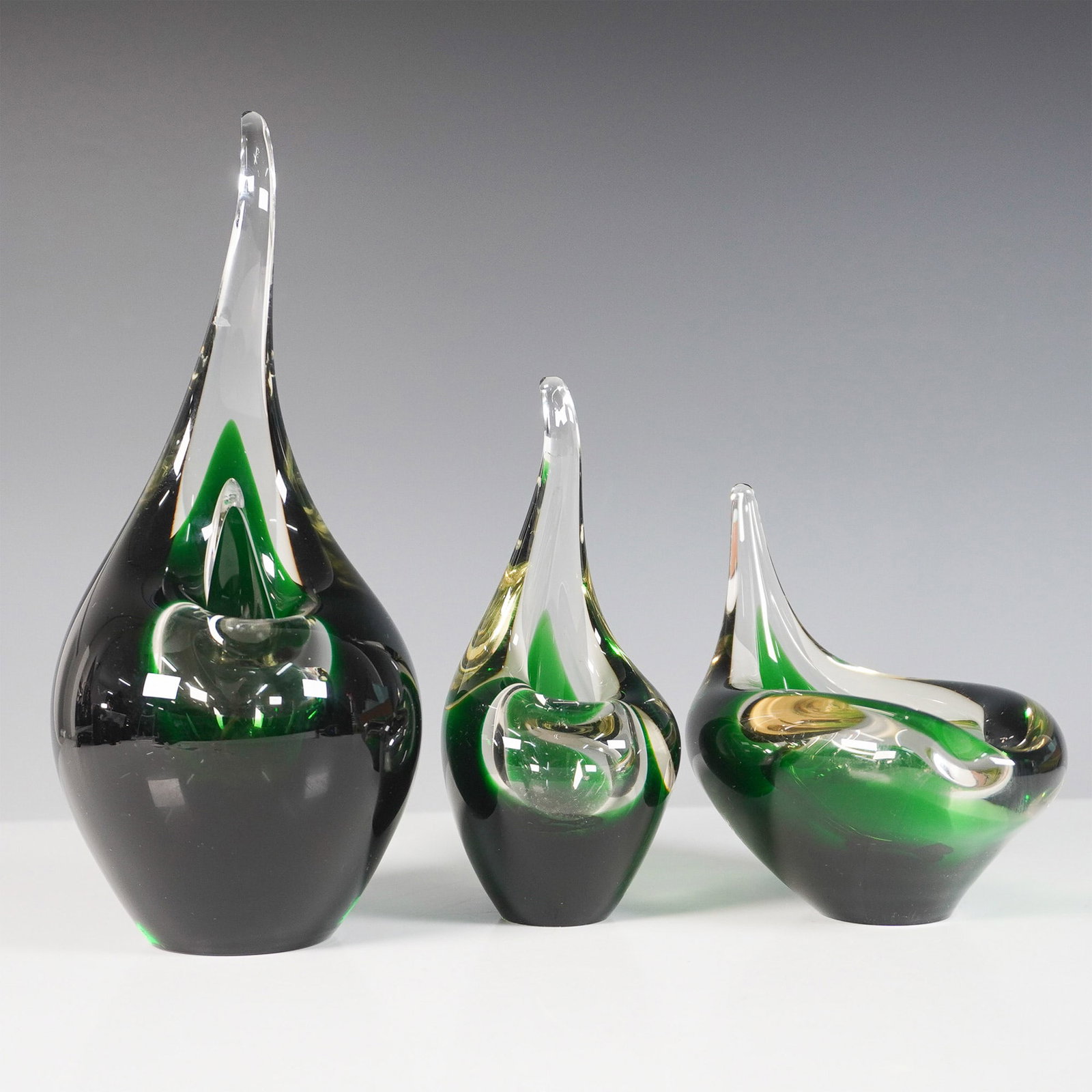 3pc Holmegaard Flamingo Vases by Per Luthen, Signed and Dated: A striking trio of Holmegaard Flamingo vases designed by Per Luthen, featuring a distinctive Mid-Century Modern aesthetic. These Danish art glass pieces showcase an elegant freeform design with rich e