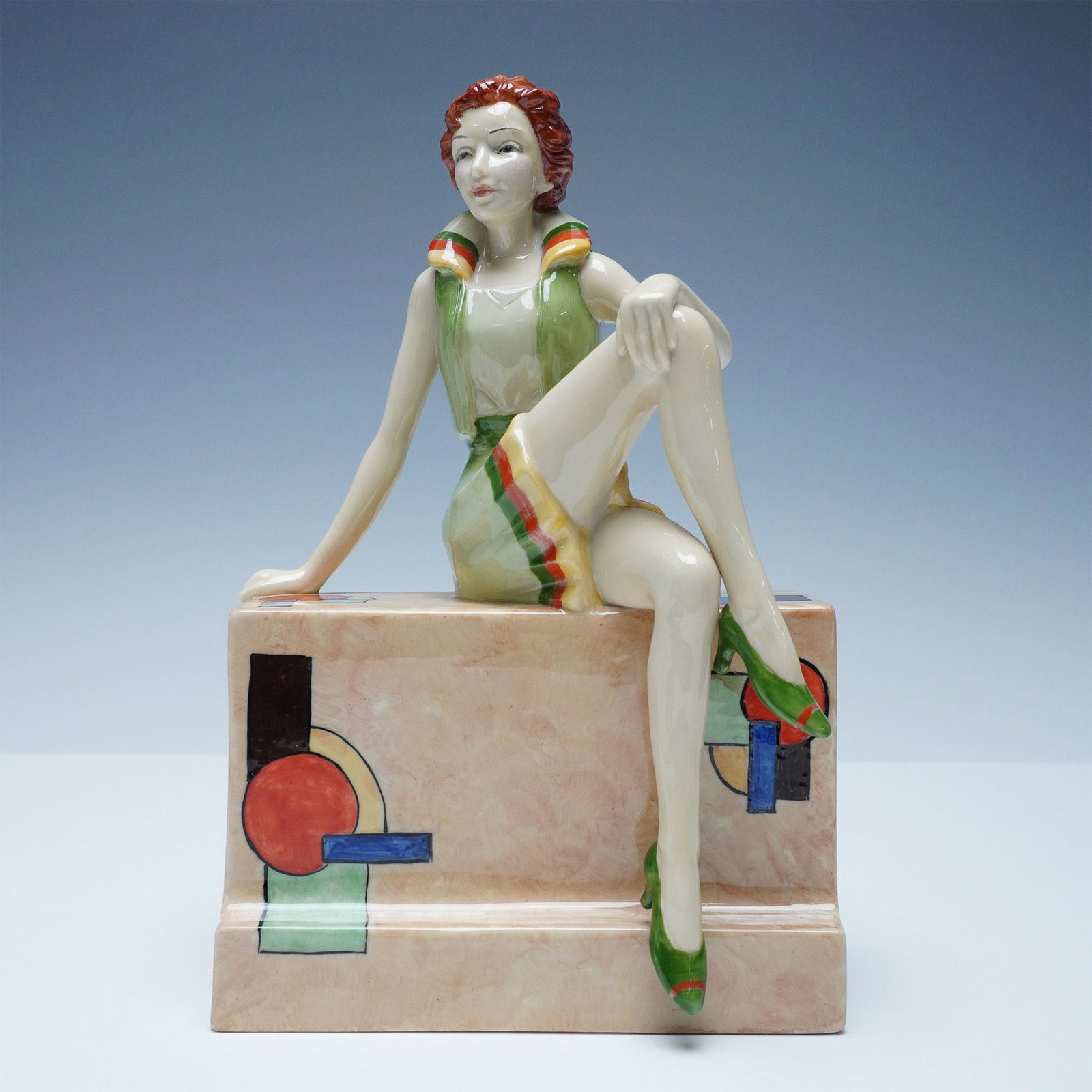 Kevin Francis Essence of June Limited Edition Figurine by Andy Moss: Beautifully crafted Essence of June figurine by Kevin Francis, designed by Andy Moss. This elegant Art Deco-inspired piece features a glamorous red-haired woman in a striking green and multicolored dr