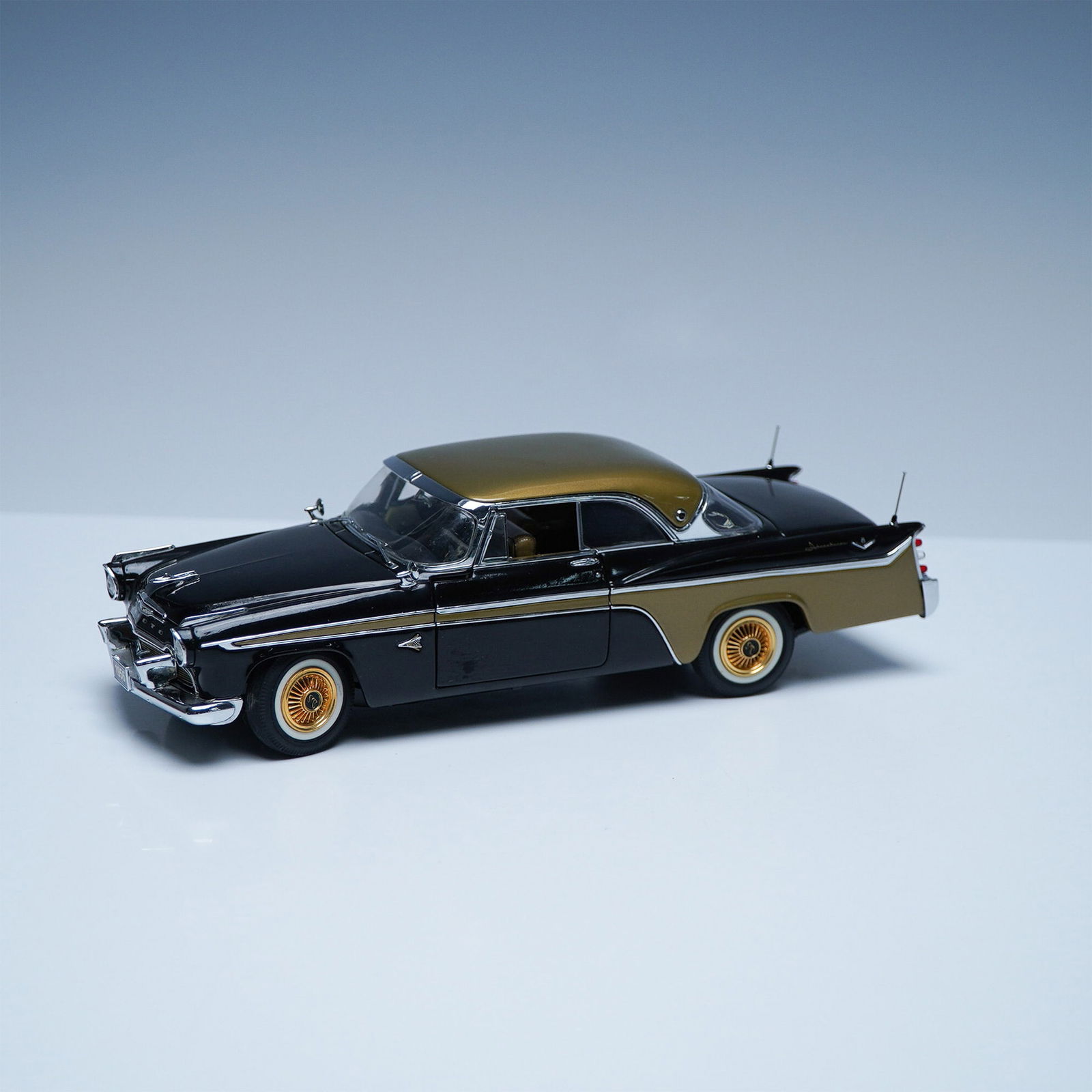 Danbury Mint 1956 DeSoto Adventurer 1:24 Scale Model: This highly detailed 1:24 scale Danbury Mint model captures the essence of the 1956 DeSoto Adventurer, a high-performance coupe that epitomized 1950s American automotive design. The model features an