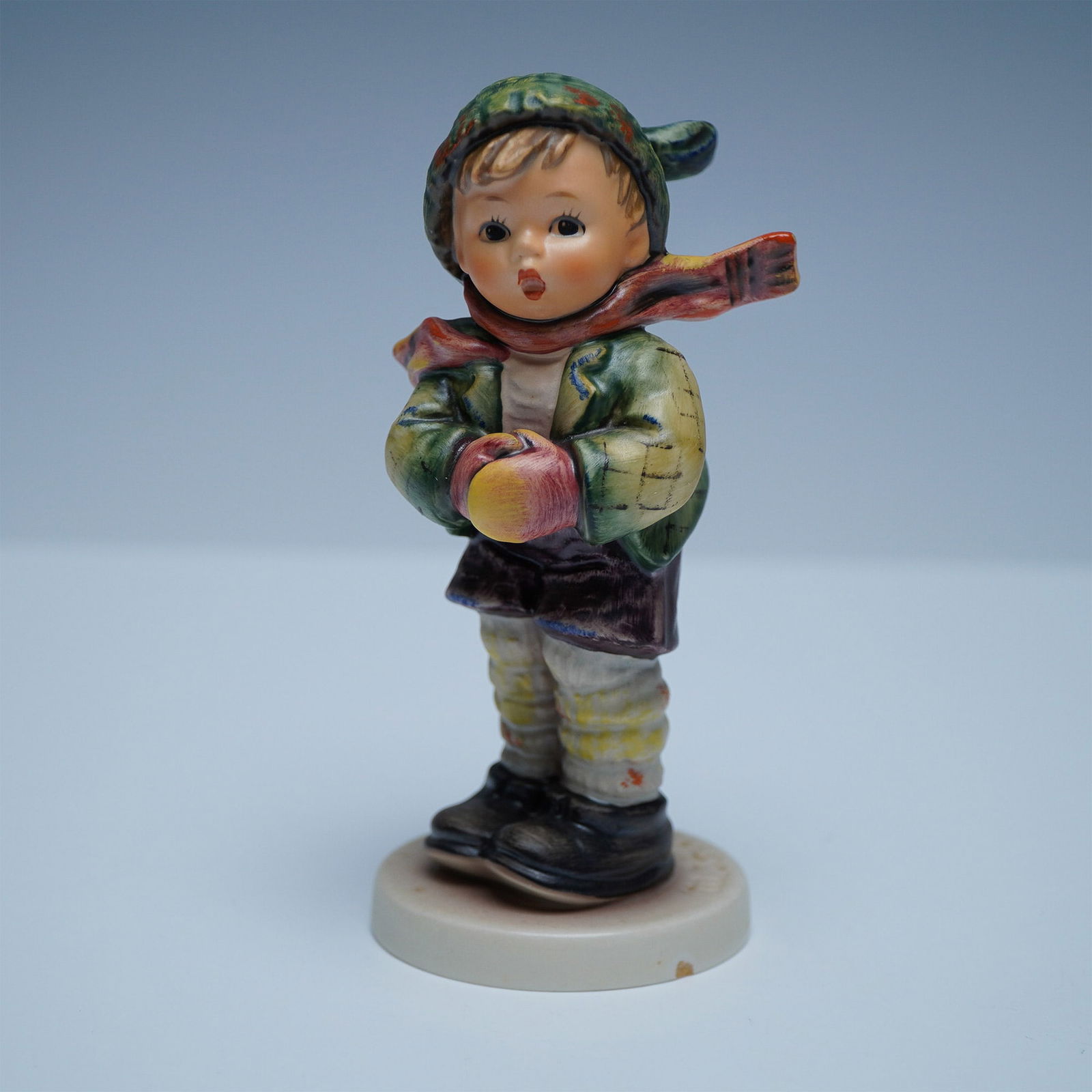 Goebel Hummel Exclusive Special Edition No. 6 Figurine: This Goebel Hummel Exclusive Special Edition No. 6 figurine was produced in 1981 for members of the Goebel Collectors Club. Featuring a charming young child dressed for winter, this hand-painted porce