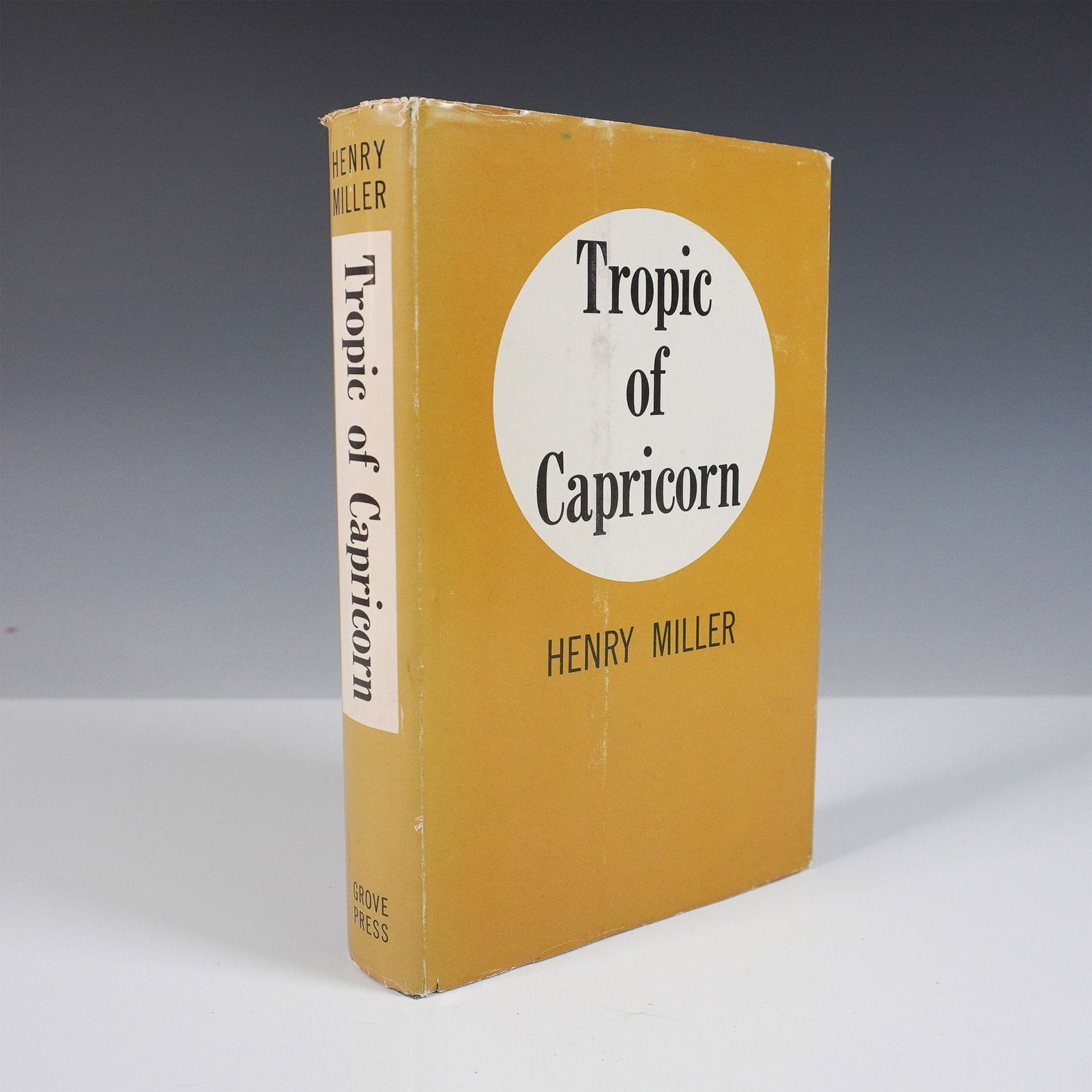 First Edition Tropic of Capricorn Book by Henry Miller: First printing of Tropic of Capricorn by Henry Miller, published in 1961 by Grove Press, Inc. This 348 page novel, a semi autobiographical work, explores themes of personal and literary freedom, sexua