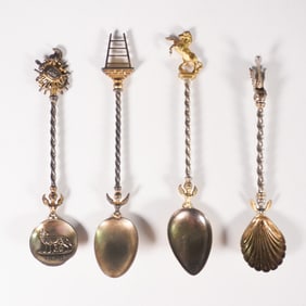 Set of Four Gilt Souvenir Spoons with Ornate Handles