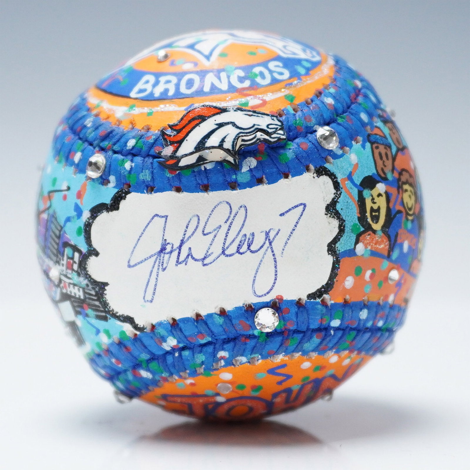 John Elway Signed Charles Fazzino Hand Painted Pop Art Baseball: John Elway themed baseball designed by Charles Fazzino (American, b. 1955), a mixed-media pop artist known for his detailed and vibrant three-dimensional works. This baseball is intricately decorated 