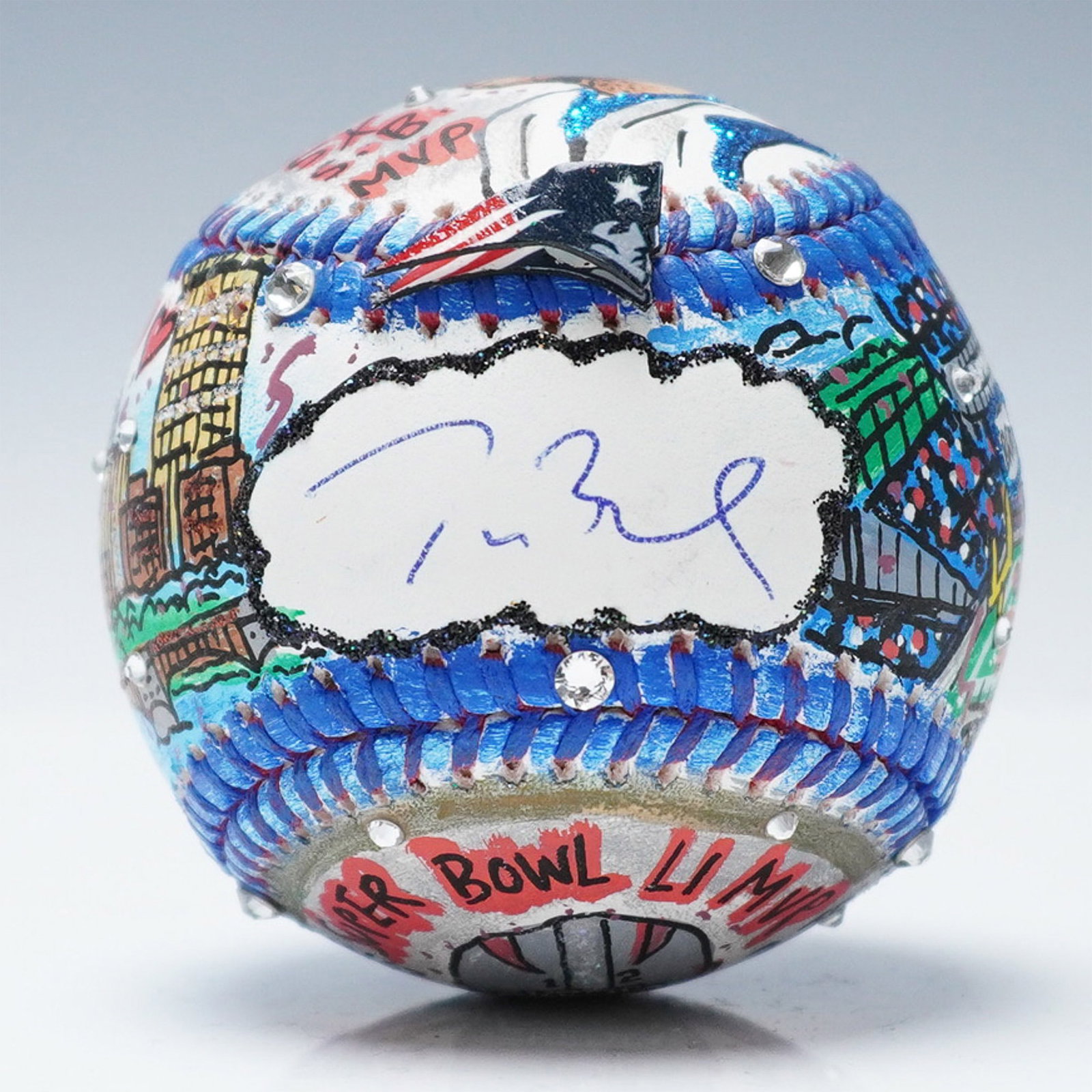 Tom Brady Signed Charles Fazzino Hand Painted Pop Art Baseball: Hand-painted mixed-media baseball by pop artist Charles Fazzino (American, b. 1955), commemorating Tom Brady's performance as Super Bowl LI MVP. The baseball is decorated with intricate illustrations 