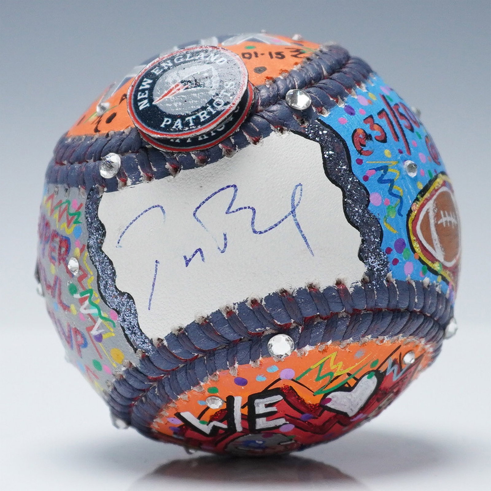 Tom Brady Signed Charles Fazzino Hand Painted Pop Art Baseball: Mixed-media baseball artwork by pop artist Charles Fazzino (American, b. 1955), celebrating Tom Brady's Super Bowl XLIX victory. The hand-painted design incorporates vibrant colors, three-dimensional 