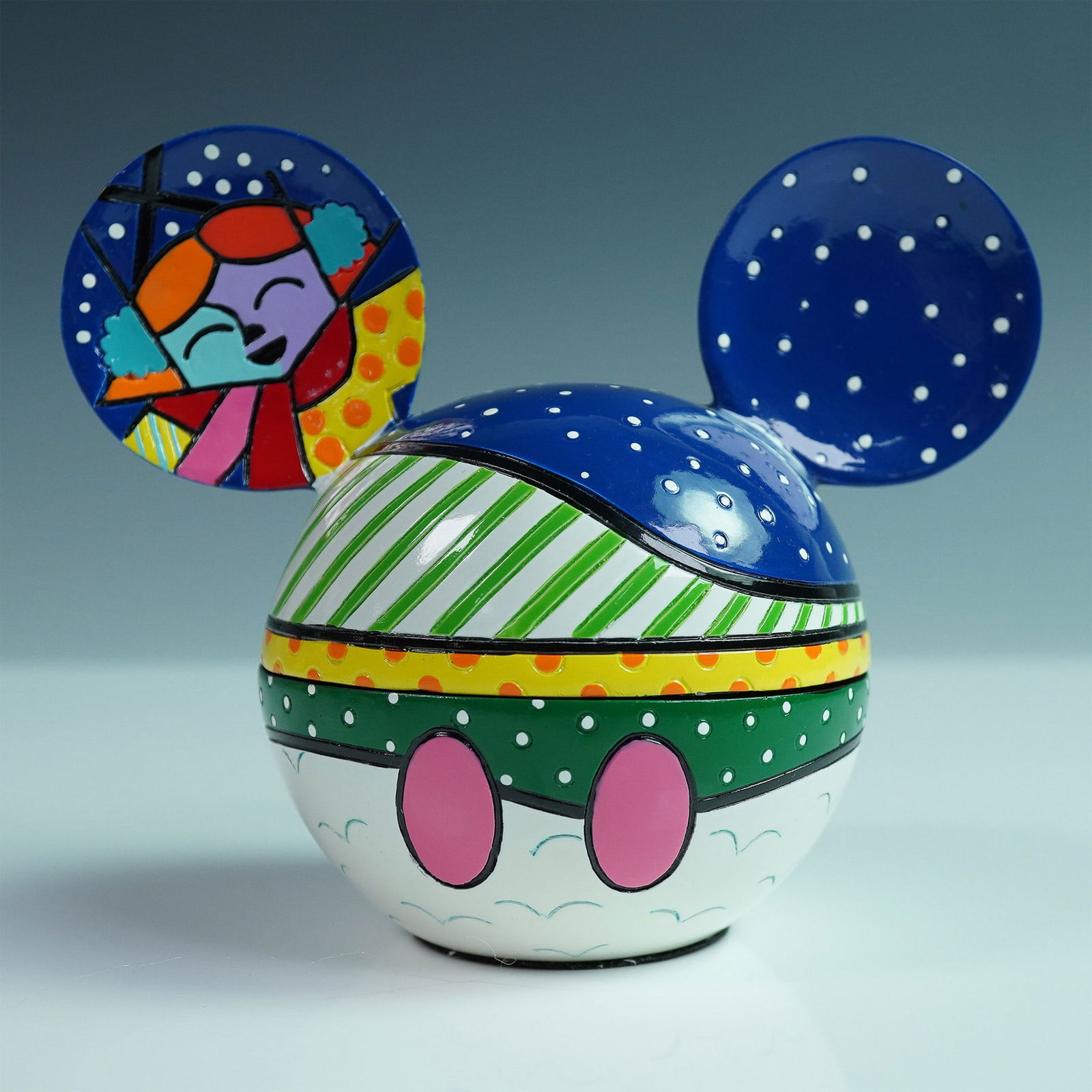 Romero Britto Disney Mickey Mouse Figurine: Vibrant and playful, this Mickey Mouse figurine by Brazilian artist Romero Britto showcases his iconic pop art style with bold stripes and polka dots. Marked with "Romero" on its base, this officially