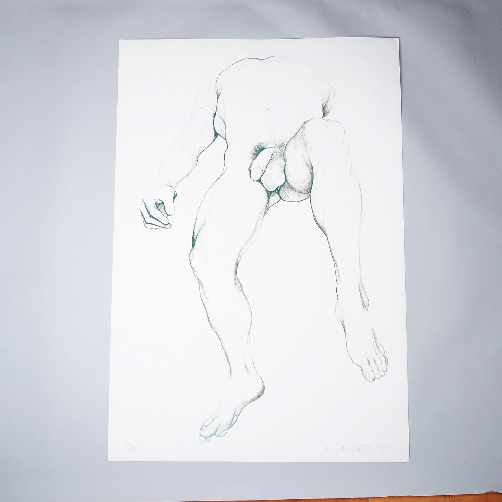 Lowell Nesbitt, Lithograph on Paper, Male Nude, Signed & Numbered: A striking lithograph by Lowell Nesbitt, depicting a male nude in a dramatic foreshortened perspective. Executed in 1979, this work showcases Nesbitt's masterful use of line and shading, emphasizing a
