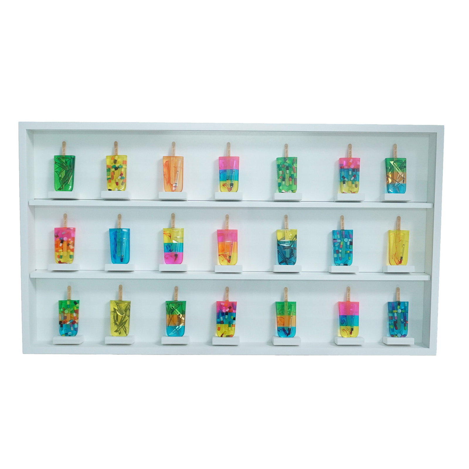 Miss Bugs, Lolly Specimen Cabinet, Signed on Certificate: Miss Bugs' Lolly Specimen Cabinet is a striking mixed-media wall sculpture exploring themes of addiction, consumer culture, and the aesthetics of contemporary desire. The piece features 21 unique resi