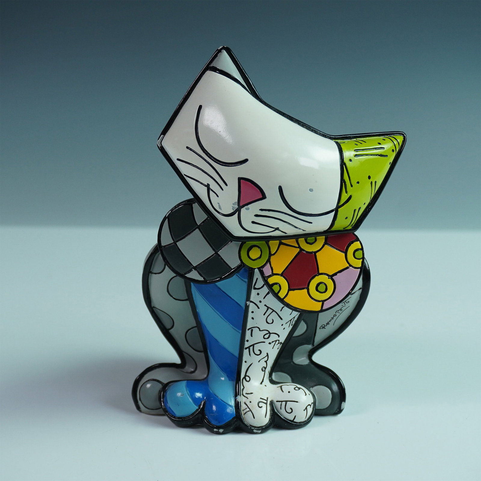 Romero Britto "Happy Cat" Sculpture, 2nd Edition: Happy Cat is a delightful sculpture from Romero Britto that captures the essence of joy and playfulness. This piece is part of Britto's acclaimed art collection known for its vivid colors and bold pat
