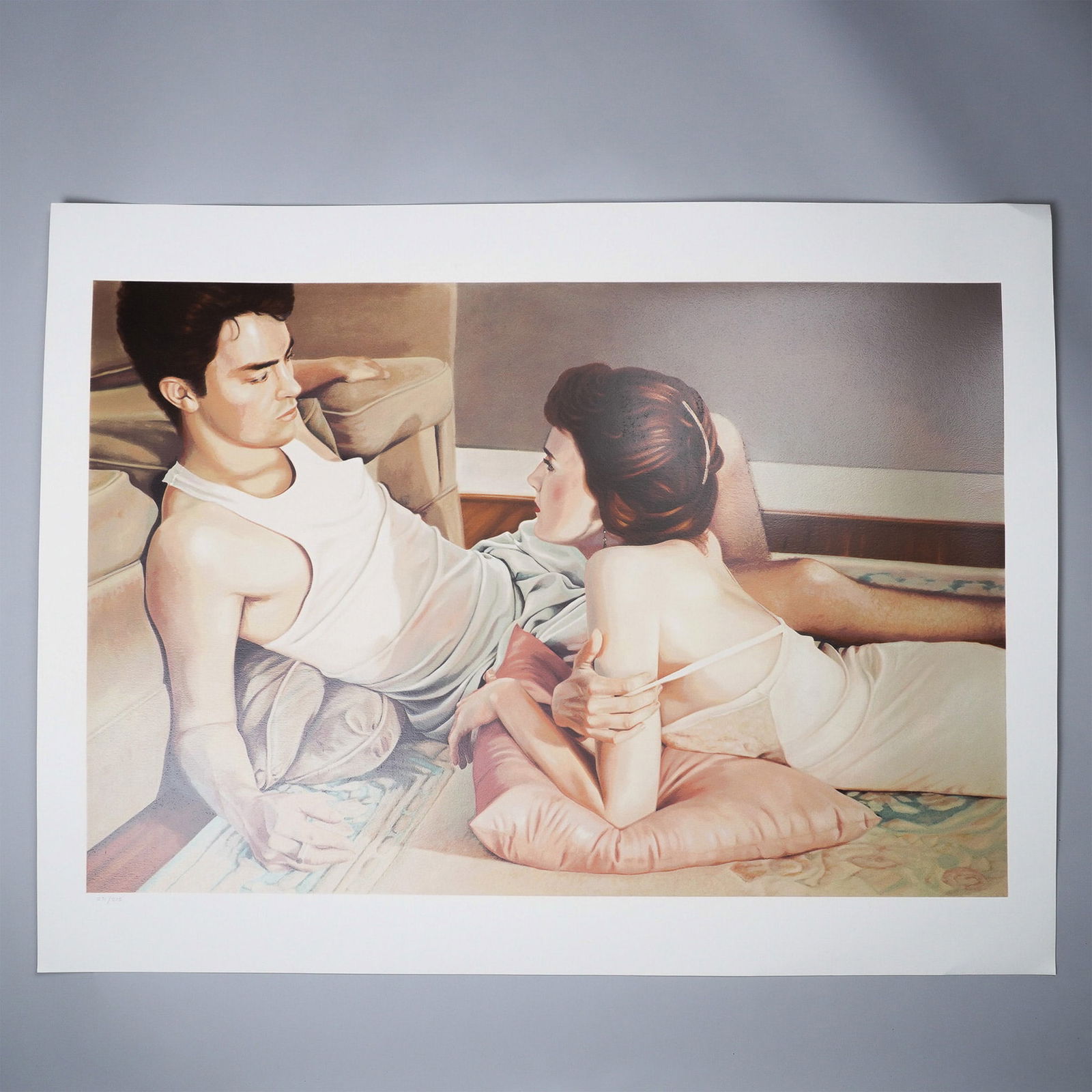 Adrian Deckbar, Limited Edition Color Lithograph on Paper, Intimacies: Limited edition lithograph by contemporary realist painter Adrian Deckbar, numbered 271 of 275. The composition depicts a young man and woman reclining in an intimate domestic setting, rendered in Dec