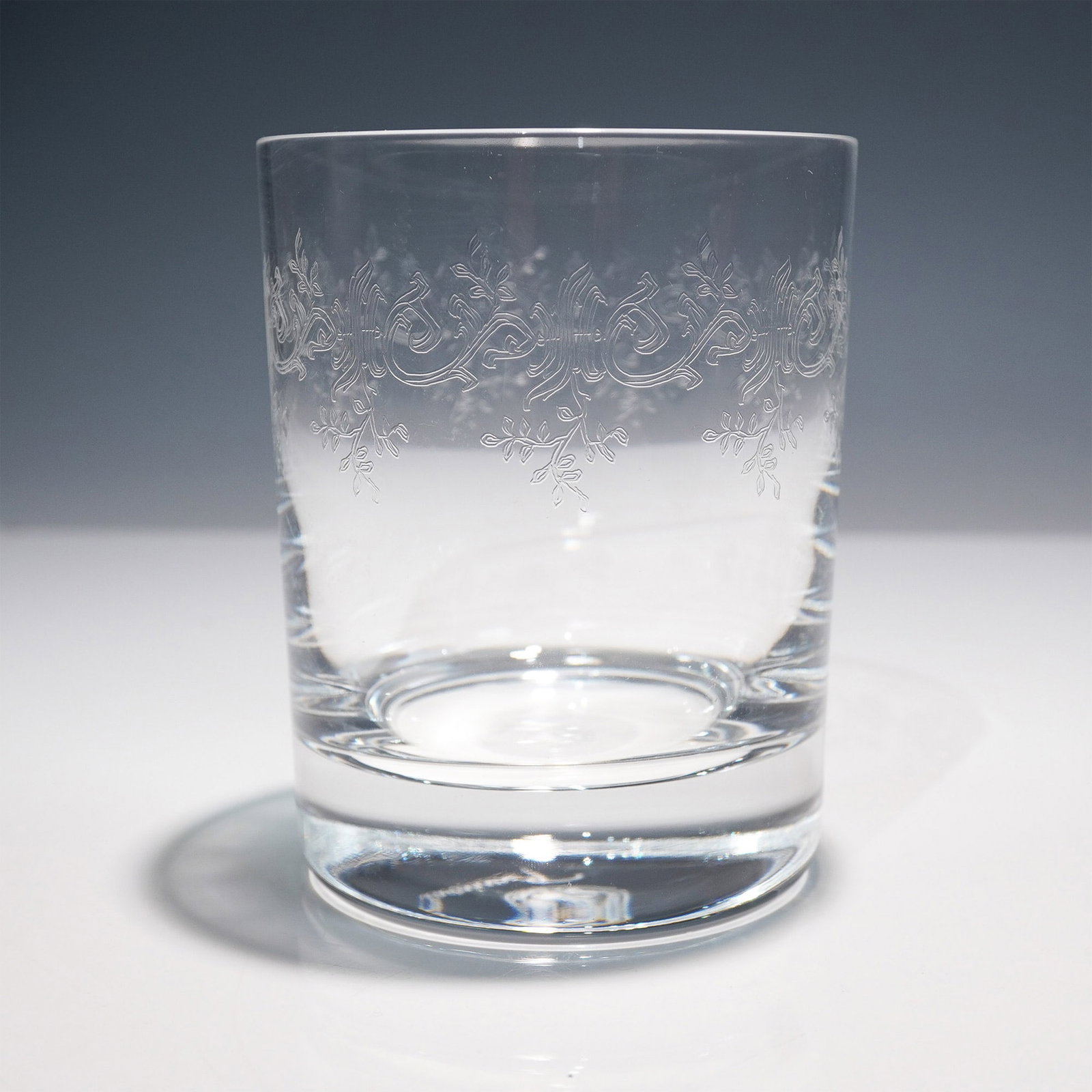 Baccarat Sevigne Engraved Crystal Tumbler: Elegant Baccarat Sevigne engraved crystal tumbler, featuring an intricate scrolling and floral pattern encircling the upper portion of the glass. This finely etched design showcases Baccarat's masterf