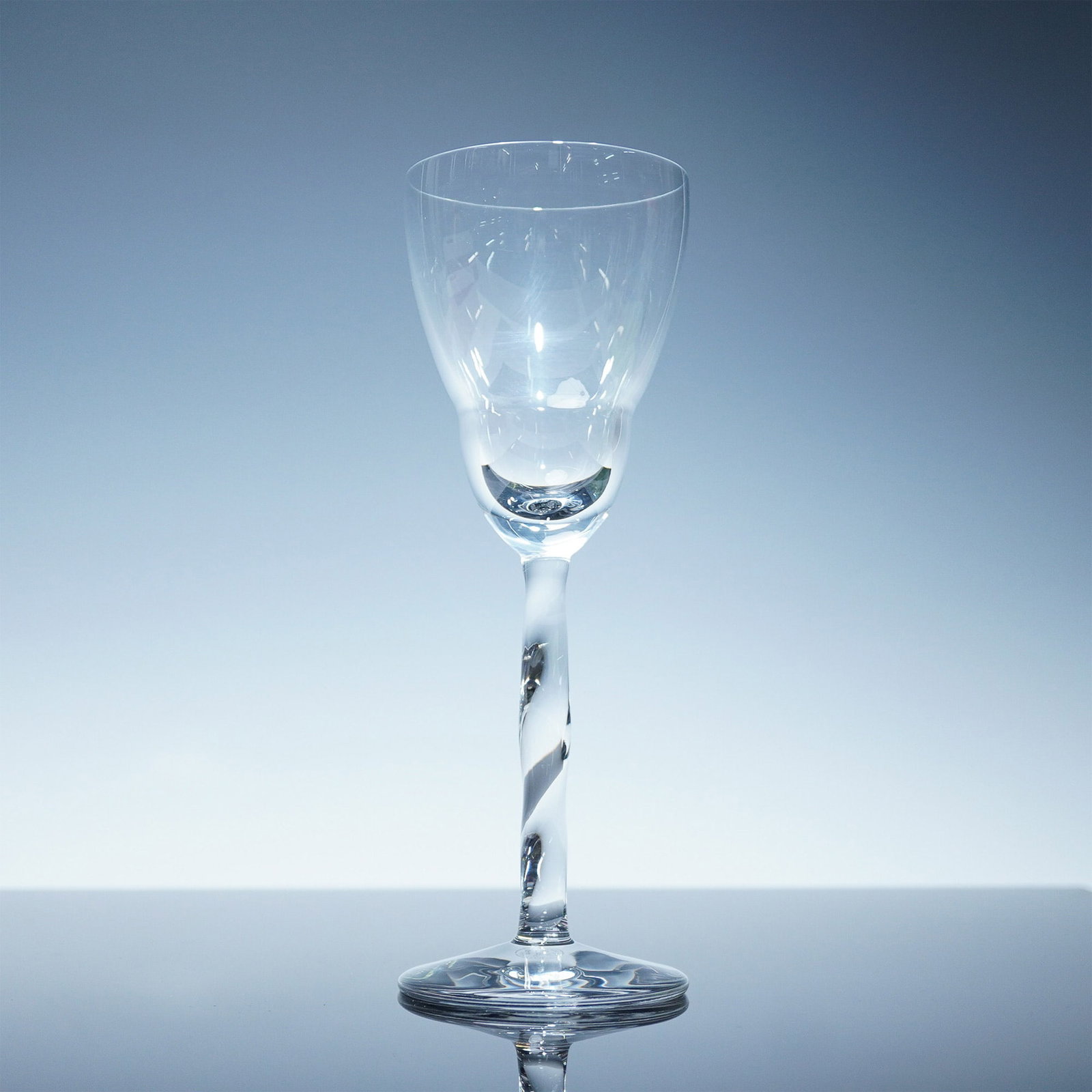 Baccarat Crystal Stream Wine Glass, Sealed Box: Refined and sculptural, this Baccarat crystal wine glass from the Stream collection features a twisted stem that catches and reflects light beautifully. Crafted in France of fine clear crystal, it sho
