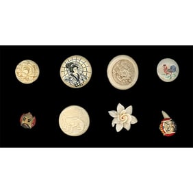 A small card of division three carved bone buttons