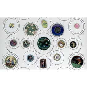 A partial card of division one assorted enamel buttons