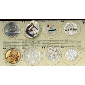 A partial card of division three assorted pearl buttons
