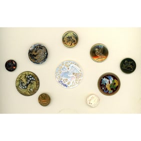 A small card of assorted material dragon buttons