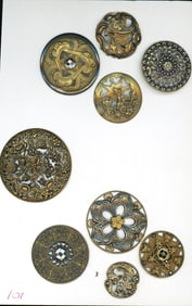 A small card of division one mostly pierced buttons