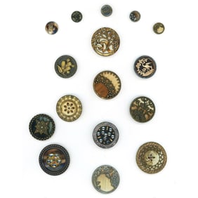 A card of assorted division one celluloid buttons