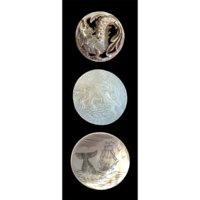 A small card of division one and three pearl buttons