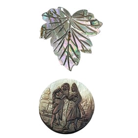 A small card of division one carved pearl buttons