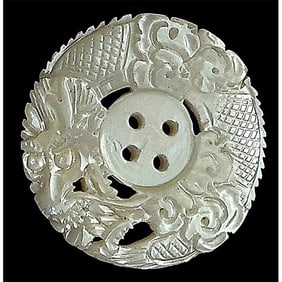 A division one 4 hole sew thru carved pearl button