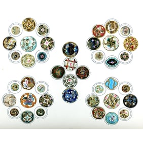 A card of assorted division one enamel buttons