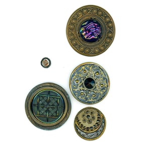 A small card of division 1 black glass in metal buttons