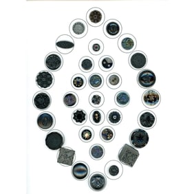 A card of assorted division one black glass buttons