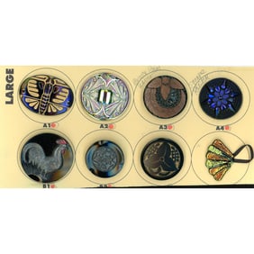 A partial card of division 1 & 3 black glass buttons