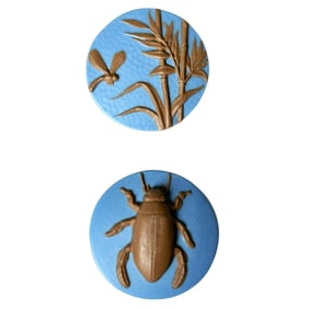 A small card of division three Studio artist buttons