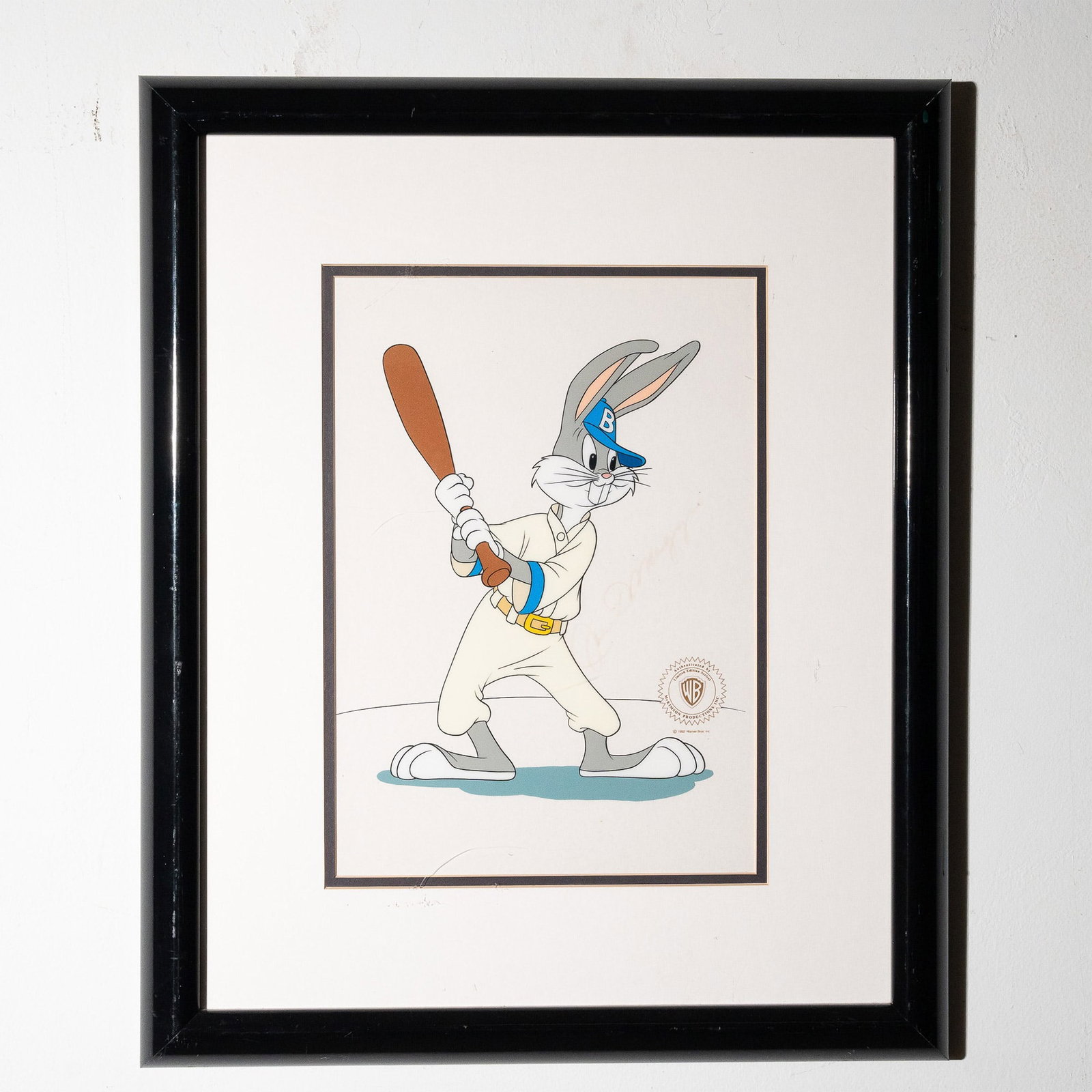 Limited Edition DiMaggio Bugs Bunny Animation Cel, Signed: This Warner Bros. limited edition animation cel features Bugs Bunny dressed as a baseball player, styled in tribute to legendary New York Yankees icon Joe DiMaggio. The cel is hand-signed by Joe DiMag