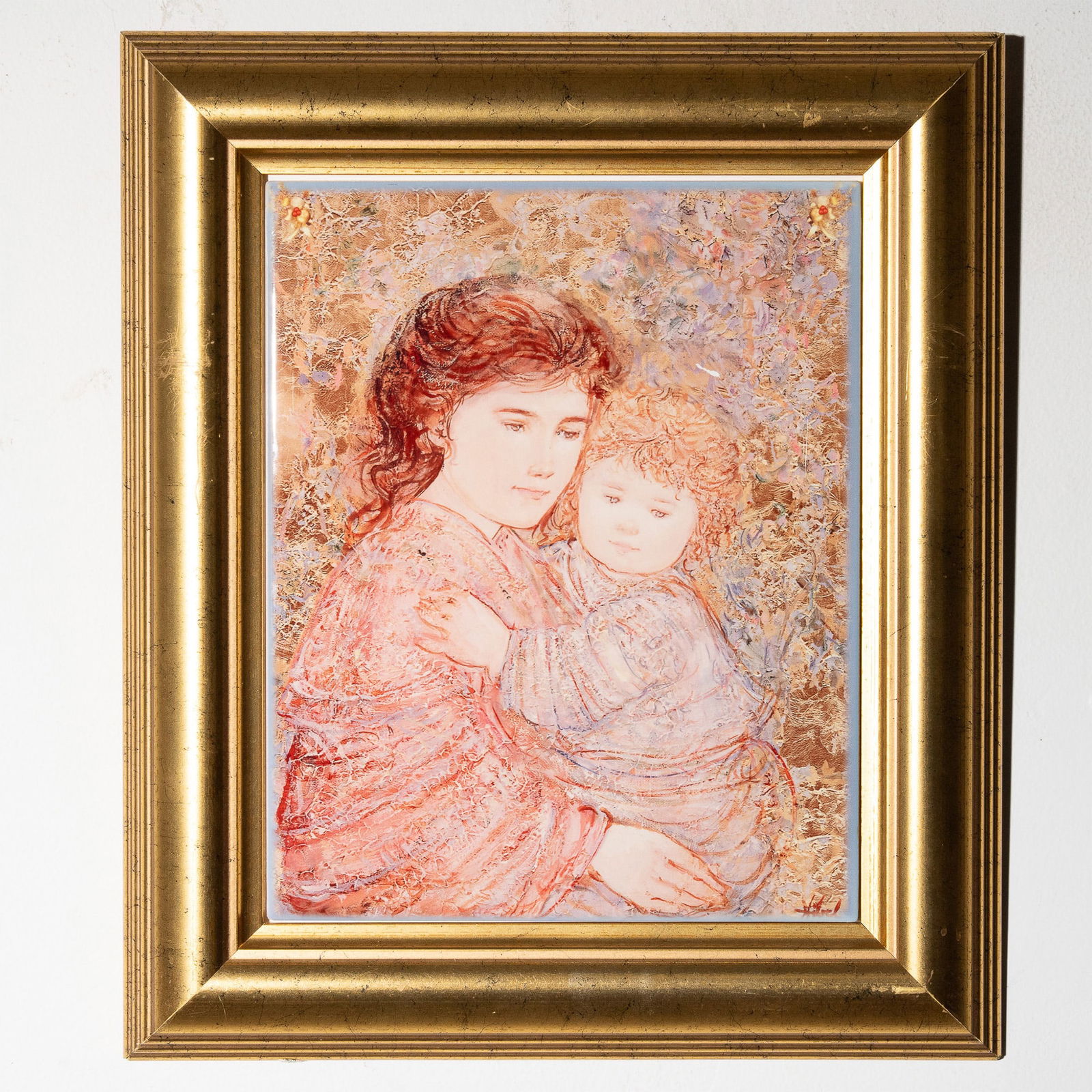 Edna Hibel Art Tile All My Delight, Signed: This framed art tile features a reproduction of Edna Hibel's painting All My Delight, showcasing her signature impressionistic style depicting a mother and child in warm, earthy tones. The tile is par