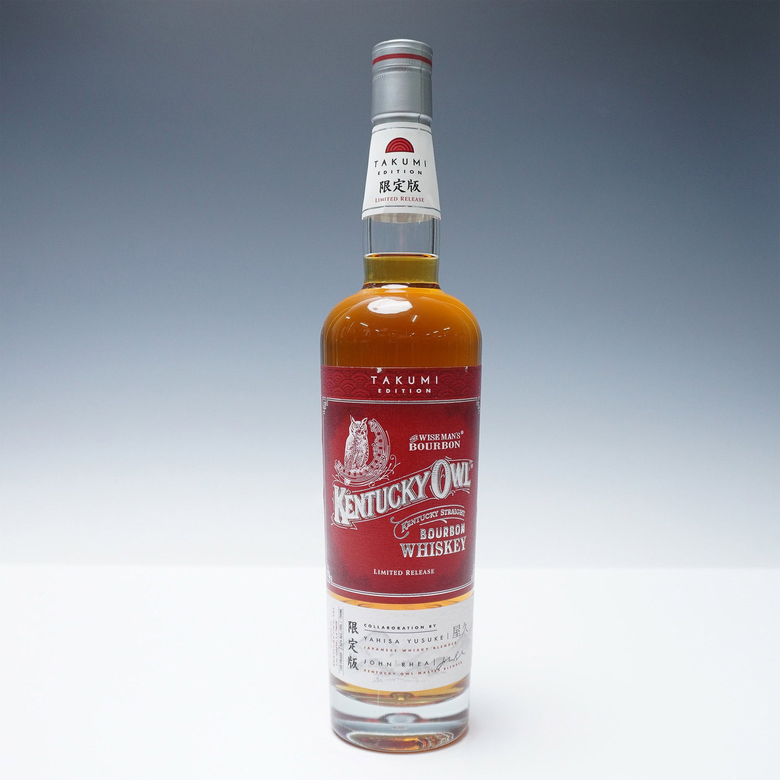 Kentucky Owl Takum Edition Bourbon Whiskey: Sealed bottle of Kentucky Owl Takumi Edition Bourbon Whiskey. This limited-release bourbon is a collaboration between Kentucky Owl and a Japanese whiskey master blender, showcasing a unique fusion of 