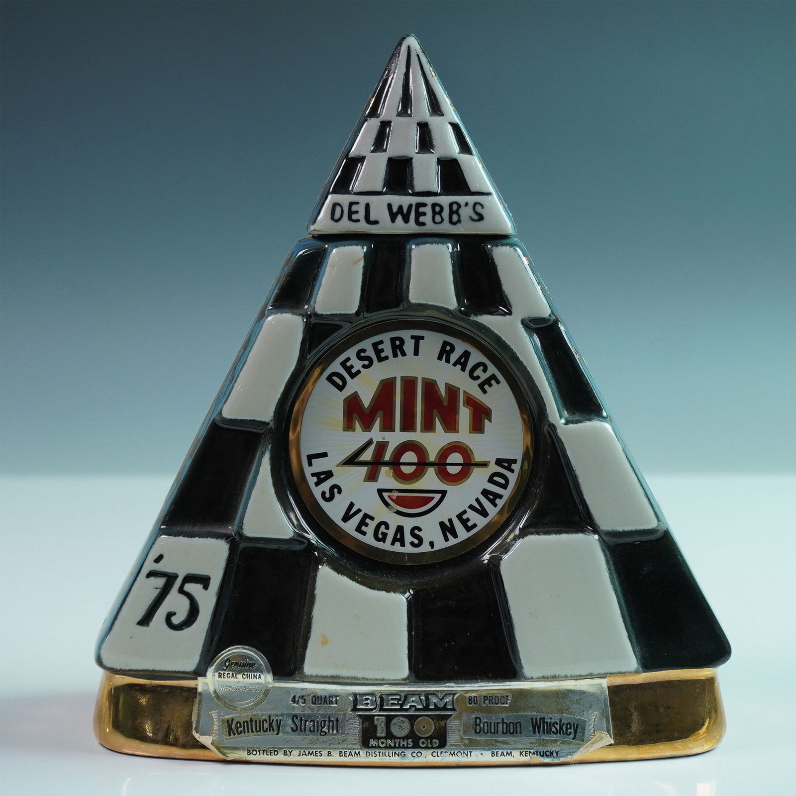 Beam Kentucky Bourbon Whiskey Bottle, Del Webb's Mint 400 Vegas Desert Race: Jim Beam Kentucky Straight Bourbon Whiskey commemorative decanter produced for the 1975 Del Webb's Mint 400 desert race in Las Vegas, Nevada. Manufactured by Regal China Corporation, this pyramid-shap