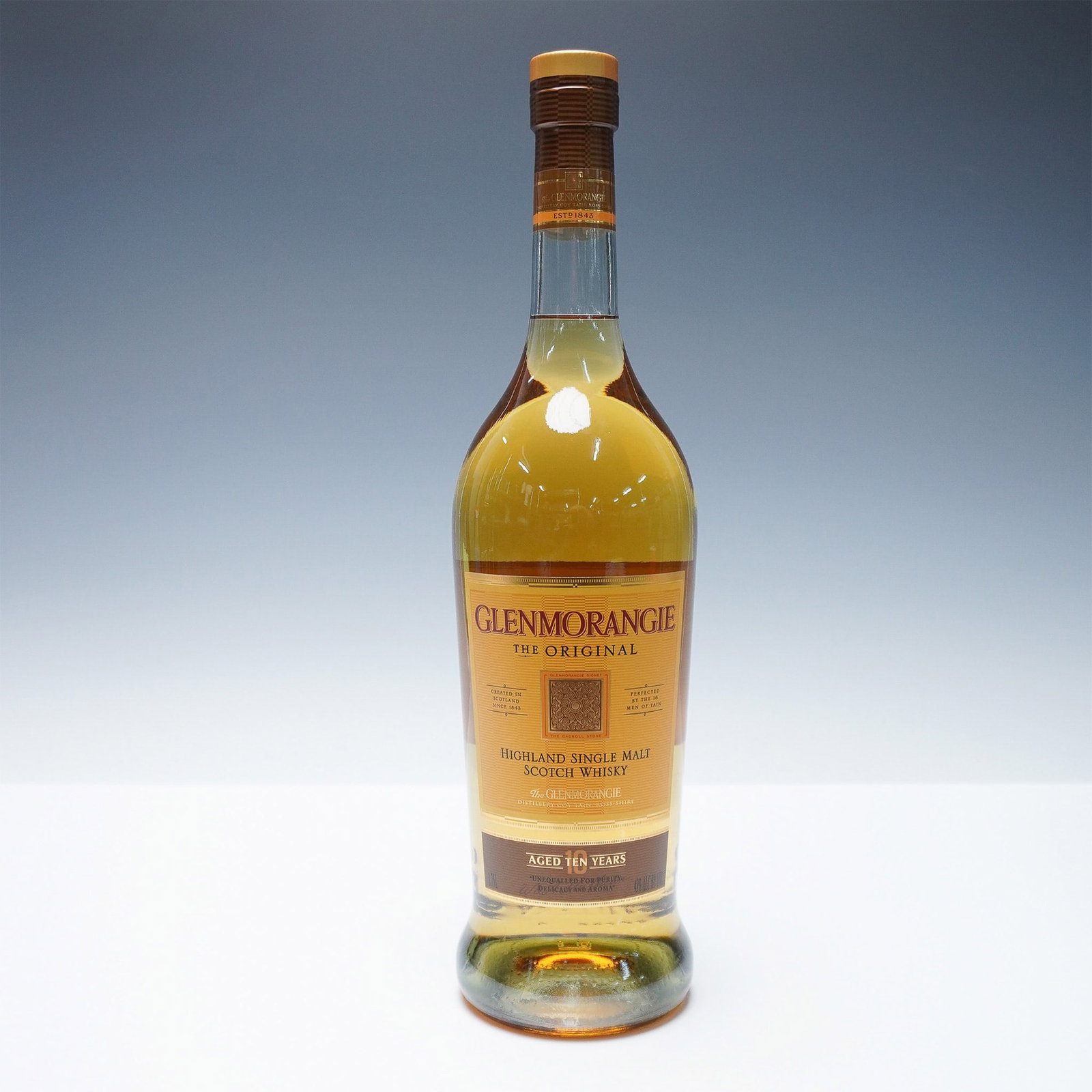 Glenmorangie The Original 10-Year-Old Highland Single Malt Scotch Whisky: A bottle of Glenmorangie The Original, a 10-year-old Highland Single Malt Scotch Whisky celebrated for its smooth and delicate profile. Aged in American white oak ex-bourbon casks, this whisky is know