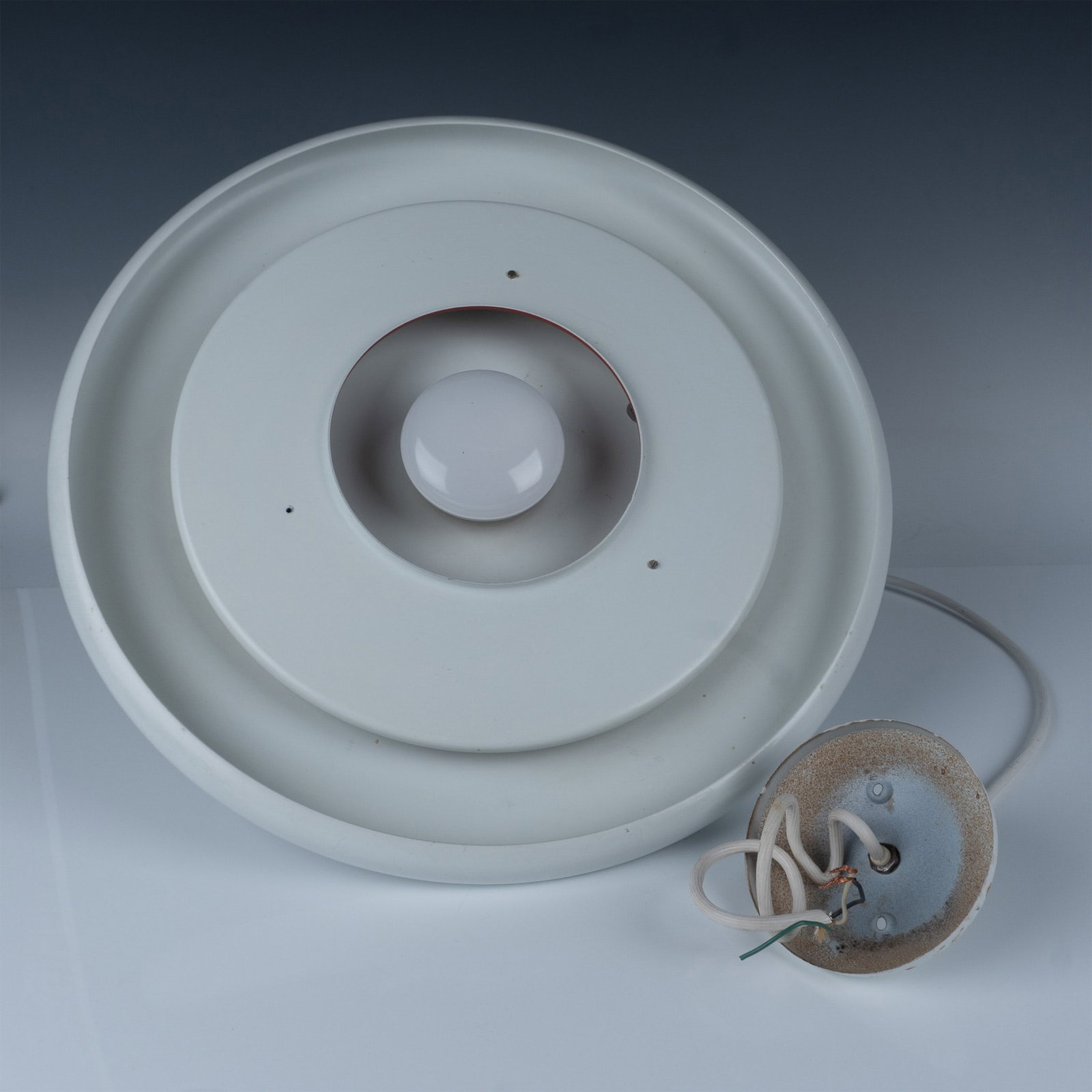 Fog and Morup Optima Pendant Light: This exquisite Optima Pendant Light by the renowned Danish design brand is a stunning example of mid-century modern lighting. The pendant's sleek, minimalist form is perfect for enhancing both contemp