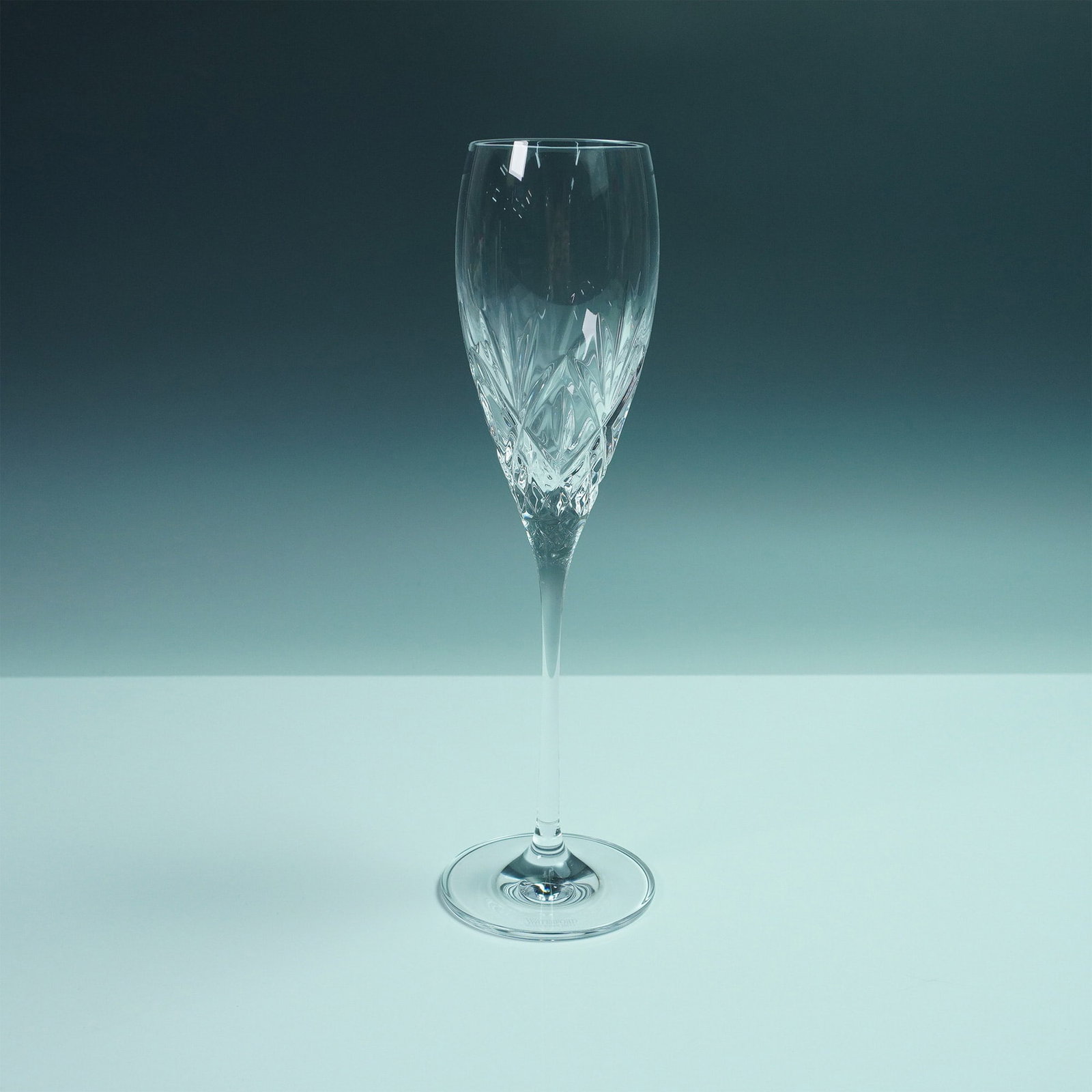 Waterford Crystal Champagne Toasting Flute, Huntley: Waterford Crystal champagne toasting flute in the Huntley pattern. Crafted in clear crystal and decorated with a combination of criss cross and fan cuts. The glass bears the Waterford acid-etched mark