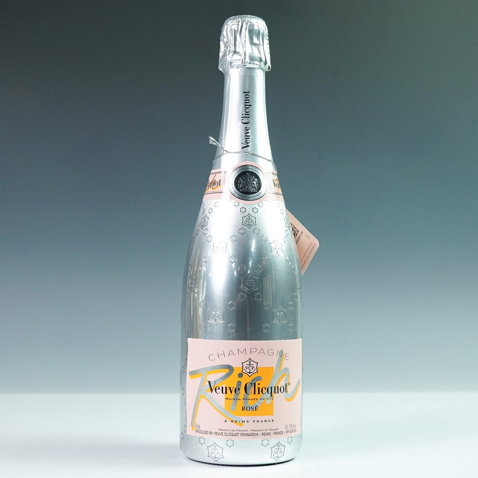 Veuve Clicquot Rich Rose Champagne: Sealed bottle of Veuve Clicquot Rose Champagne. Produced in France by Veuve Clicquot Ponsardin, this champagne is known for its blend of Pinot Noir, Pinot Meunier, and Chardonnay grapes. The 750ml bot