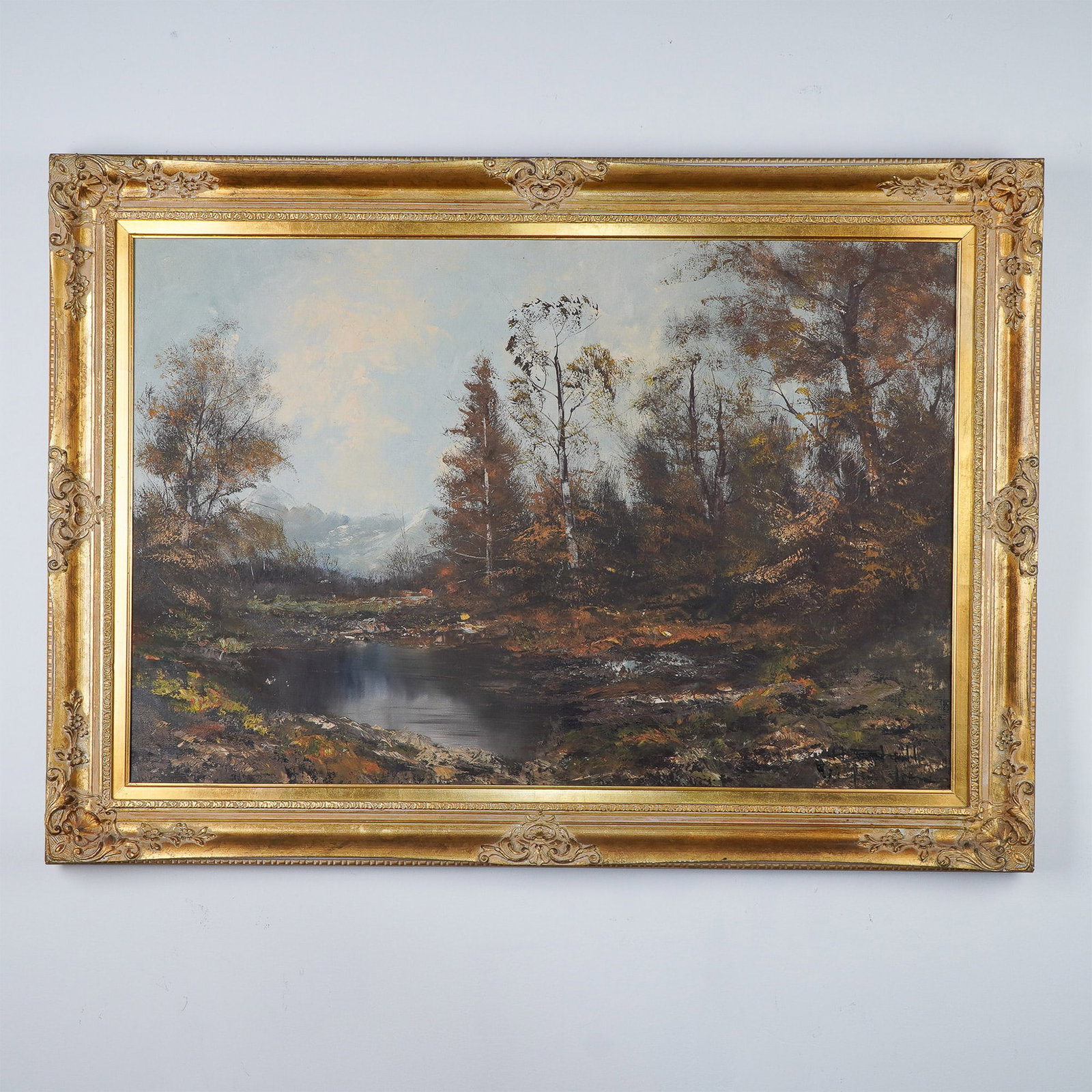 H. Stadler, Oil on Canvas, Forest Landscape, Signed : This evocative oil painting on canvas by German artist H. Stadler captures a tranquil landscape featuring a reflective body of water framed by lush trees, leading to distant snow-capped mountains. Sta