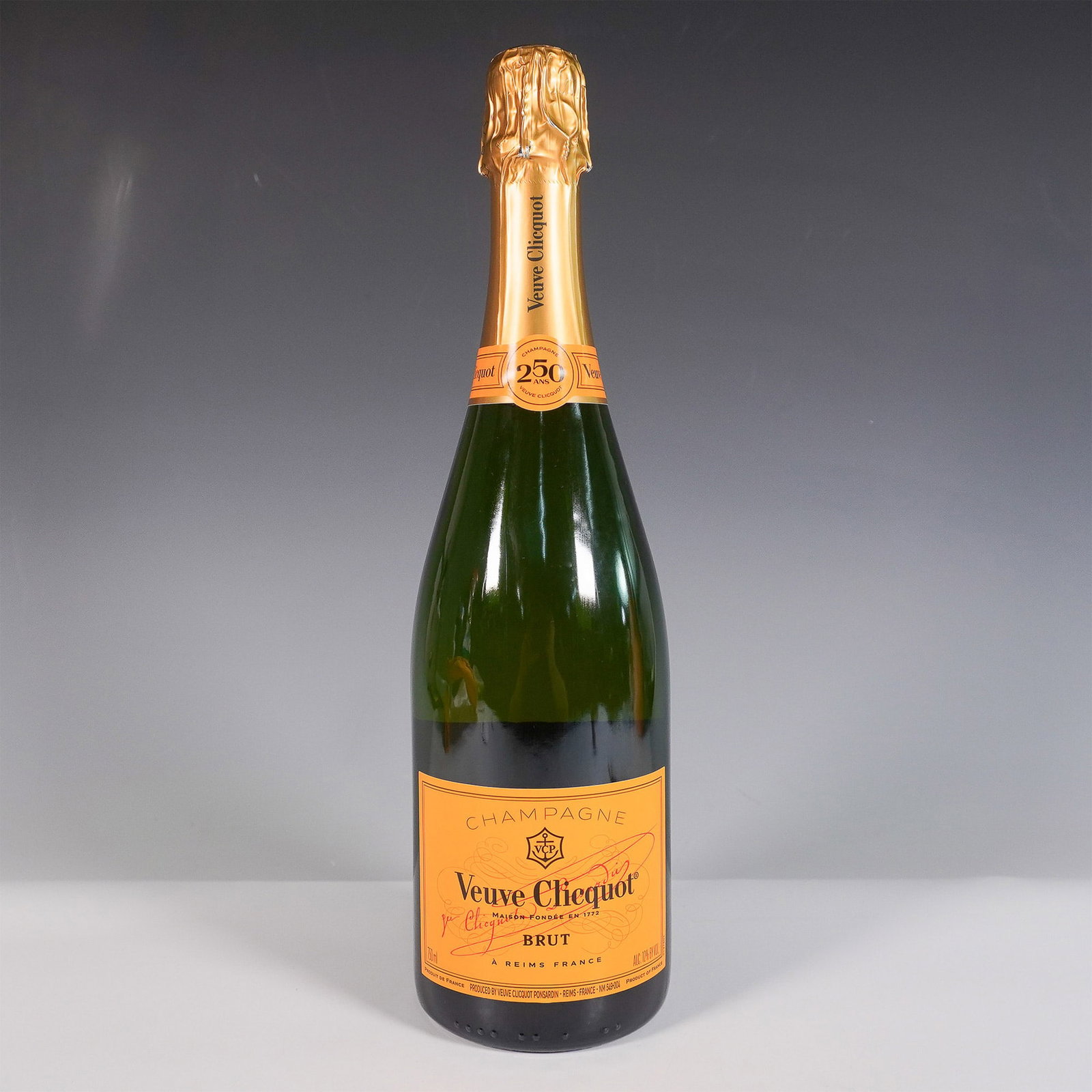 Veuve Clicquot Brut Champagne With Isothermal Sleeve: Veuve Clicquot Brut Champagne, renowned for its crisp palate of orchard fruit, brioche, and refined minerality, is paired with a branded isothermal sleeve designed to keep it chilled. Founded in 1772,