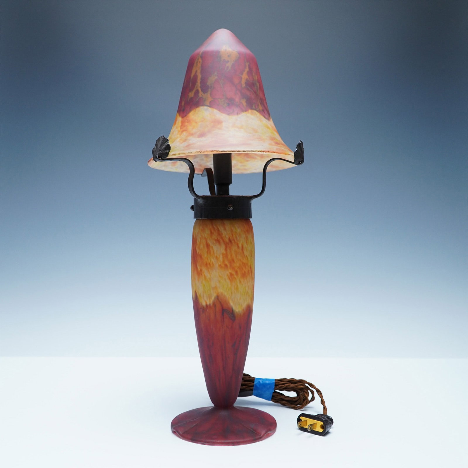 Schneider Mottled Glass Lamp Shade and Base: This Schneider mottled glass lamp, dating to the 1930s, showcases the artist's craftsmanship and striking color palette. The lamp features a removable glass shade and base, both exhibiting a vibrant c